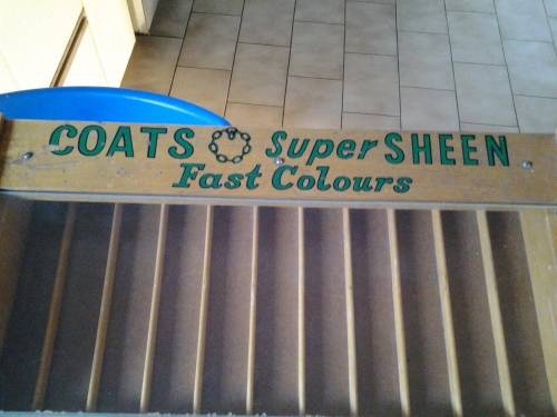 antique coats advertising haberdashery cabinet